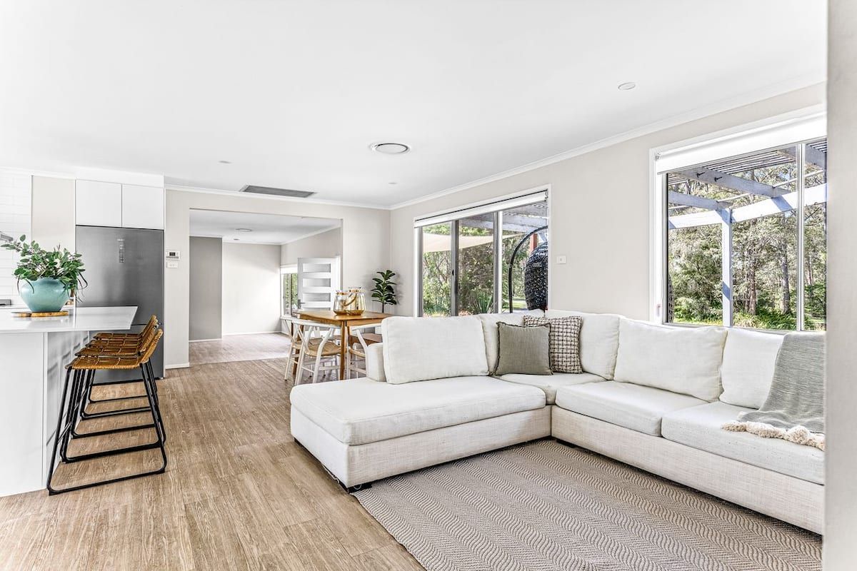 Aerial view of Jervis Bay Coastal Farm Retreat property with pool and farmland